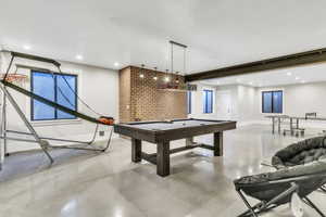 Game room with concrete floors, billiards table, and recessed lighting