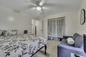 Bedroom with carpet and a ceiling fan