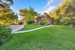 View of driveway and newly laid path to entry of basement apartment.