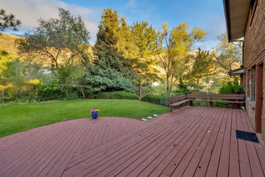 Large deck with built-in seating, beautiful & secluded large yard with plenty of space to BBQ and gather for tons of enjoyment!. (Remember there are extra parking spaces too!)