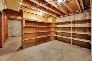 Huge storage room with lots of built-in shelving!