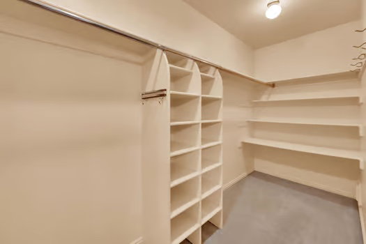 Huge Master Closet with built-in shelving--plenty of room to spread out.
