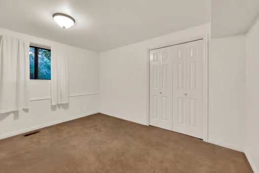 2ns Basement bedroom featuring double-wide closet.