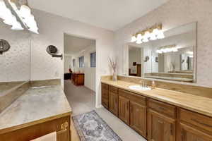 Generous Master Bathroom with two extra large counters & mirrors, & more privacy with separate tub and toilet room.