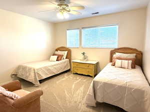 Little girl's bedroom with  ceiling fan, lots of light and great closet space.