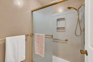 Full bath featuring enclosed tub / shower combo