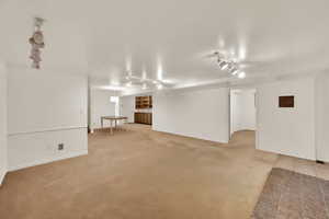 Open Bsmt Family Room and Dining with built-in shelving and lot of extra storage!