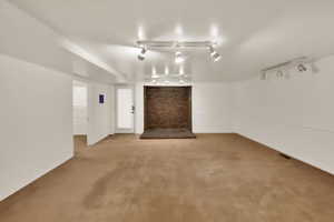 Bsmt Apartment Family Room and Dining Rm (Nice and Open) featuring adjustable rail lighting