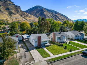 View of mountain backdrop featuring nearby suburban area