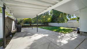 Fenced backyard with a patio