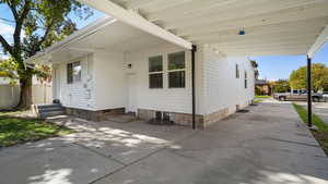 View of side of home featuring entry steps and crawl space