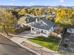 Aerial perspective of suburban area featuring a mountain backdrop