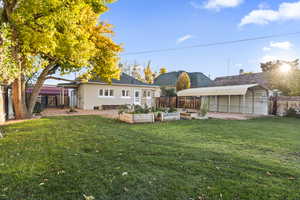 Fenced backyard with a garden