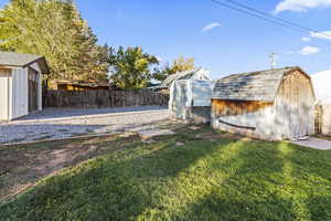 Fenced backyard with a shed