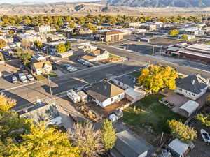 Aerial perspective of suburban area featuring a mountain backdrop
