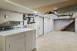 Laundry room featuring washing machine and clothes dryer