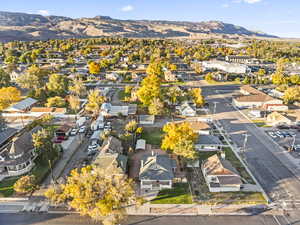 Aerial view of residential area featuring a mountainous background