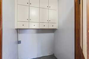 Washroom featuring a textured wall