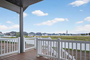 Wooden terrace featuring a residential view
