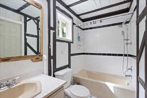 Bathroom with bathing tub /shower combination.