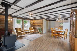 The cabin comes furnished with these furniture items: buffet, dining table/chairs, 2 wing back chairs, loveseat, misc tables/desk.