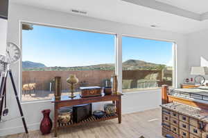 Sunroom / solarium with a mountain view