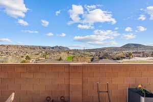 Balcony featuring a mountain view and a residential view