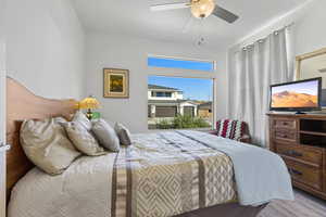 Bedroom featuring ceiling fan and wood finished floors
