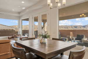 Dining area featuring a mountain view and recessed lighting
