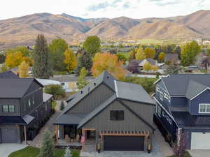 Aerial perspective of suburban area featuring a mountainous background