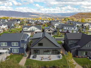 Aerial perspective of suburban area featuring a mountain backdrop