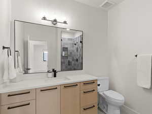 Bathroom with vanity and a stall shower