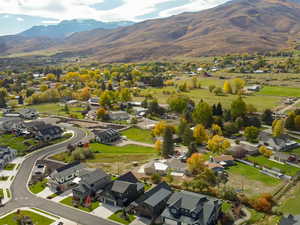 View of property location featuring mountains and nearby suburban area