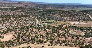 Overview of rural landscape featuring a mountainous background and a desert landscape