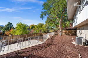Fenced backyard featuring a patio