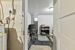 Office space featuring a textured ceiling