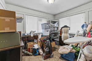 Bedroom with carpet and a textured ceiling