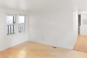 Spare room with light wood-style flooring