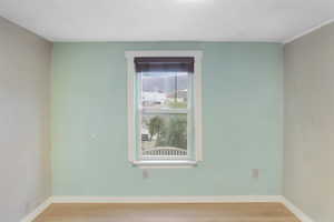 Spare room with light wood-style flooring