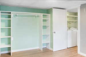 Closet featuring independent washer and dryer