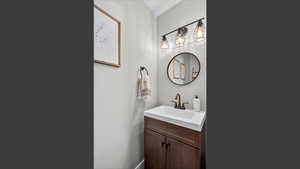 Bathroom with vanity and baseboards