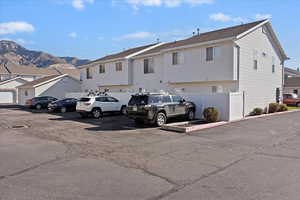 View of parking / parking lot with a residential view