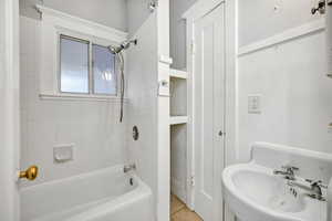 Full bath featuring shower / bath combo