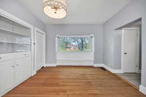 Dining area featuring light wood finished floors and baseboards.