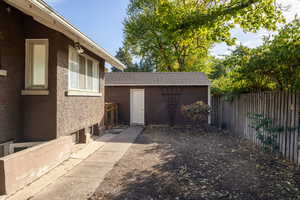 Fenced backyard entrance to garage.