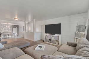 Living area featuring wood finished floors and wood walls