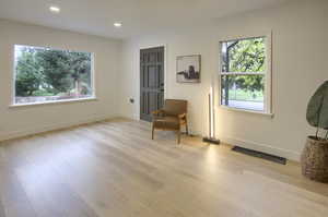 Living area featuring recessed lighting and light wood-type flooring