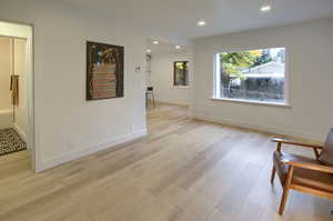Unfurnished room with recessed lighting and light wood-style floors