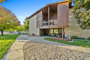 Front door view with a covered patio