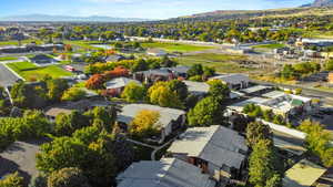 Aerial perspective of suburban area with a mountainous background
